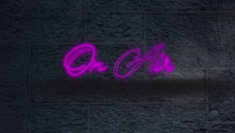 neon purple on air text against black brick wall in background