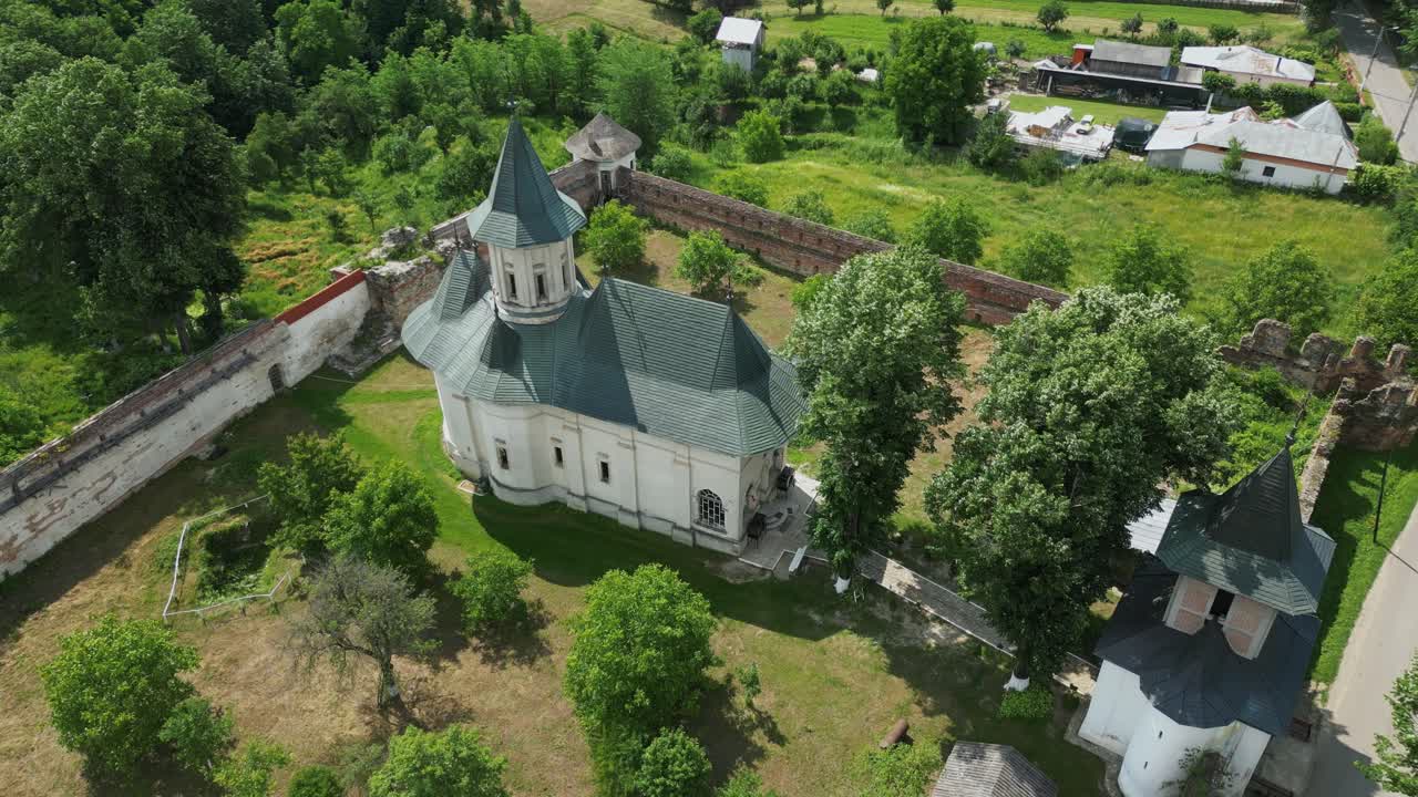 Fortified Walls With Tranquil Countryside At Mera Orthodox Monastery In Vrancea, Romania. Aerial Drone Rotate Shot