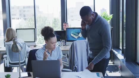 young man and woman working on computer