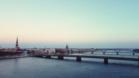 traffic over the stone bridge in riga, aerial view in winter