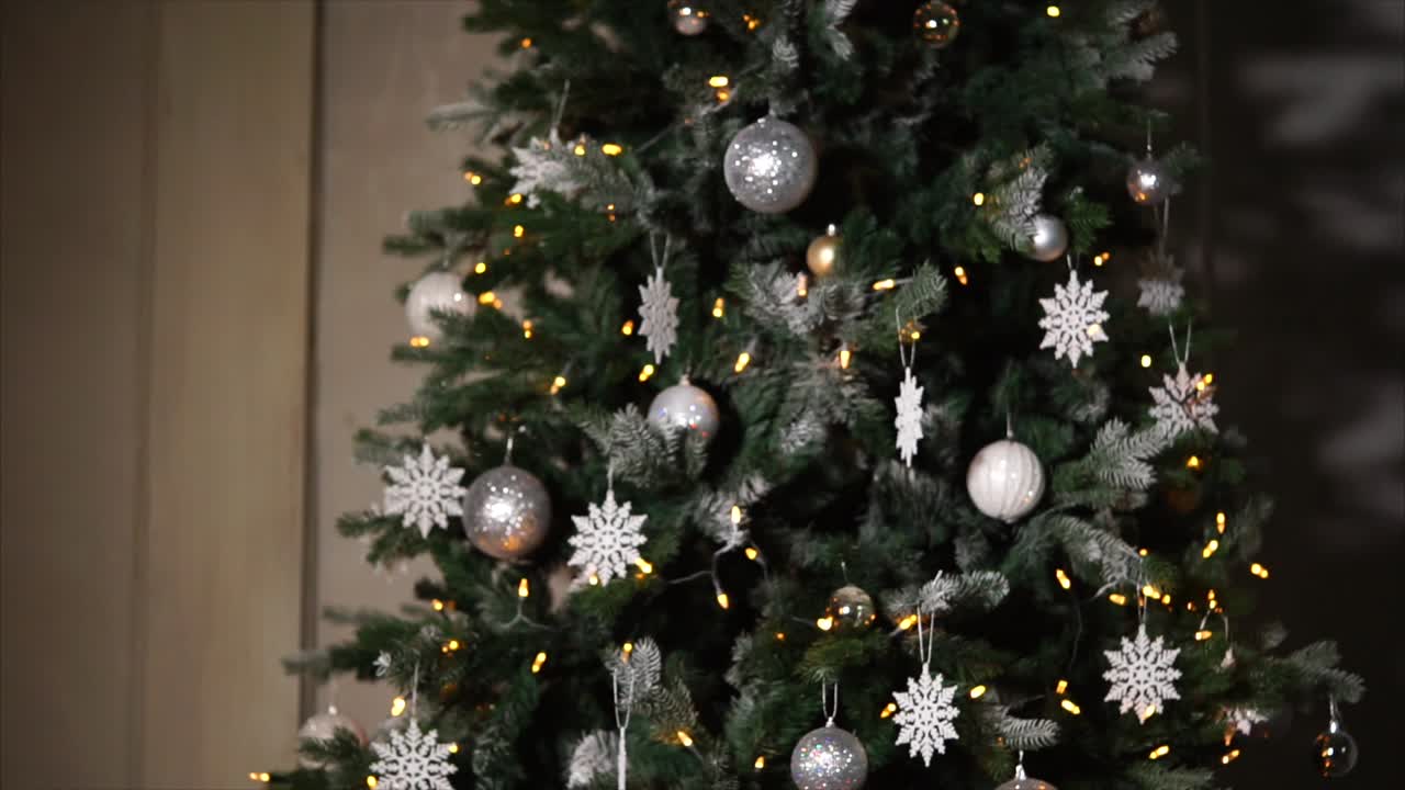 Christmas Tree Decorated with Silver and White Ornaments