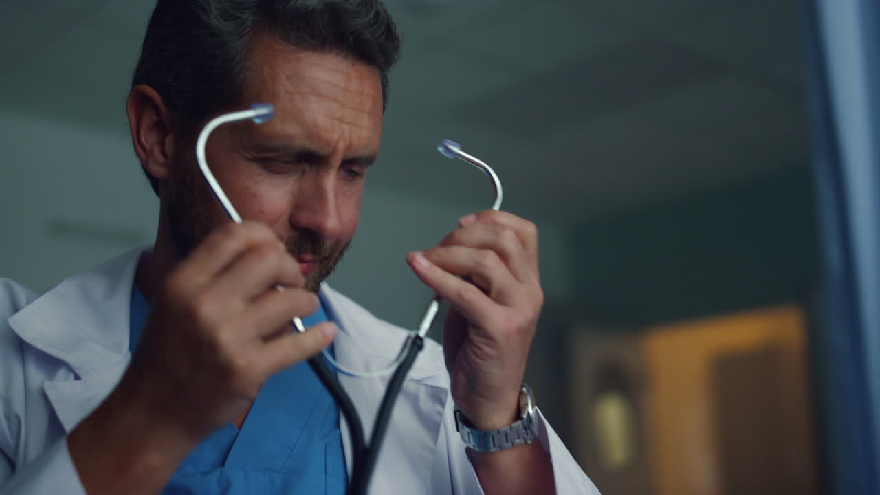 Portrait therapist holding stethoscope in ward. Medical examination in hospital