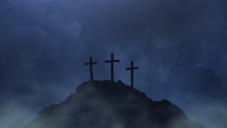 three crosses on a mountain silhouette against a thunderstorm dark cloud background