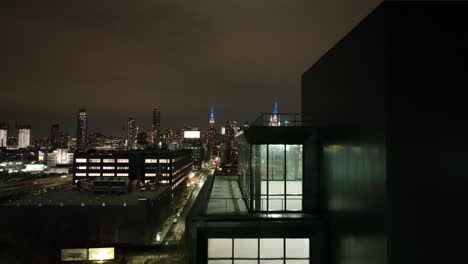 an aerial view over long island city, new york at night