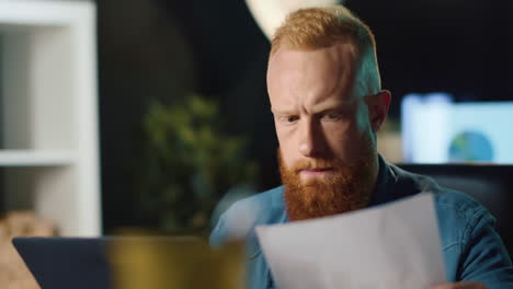 pensive business man checking data on laptop