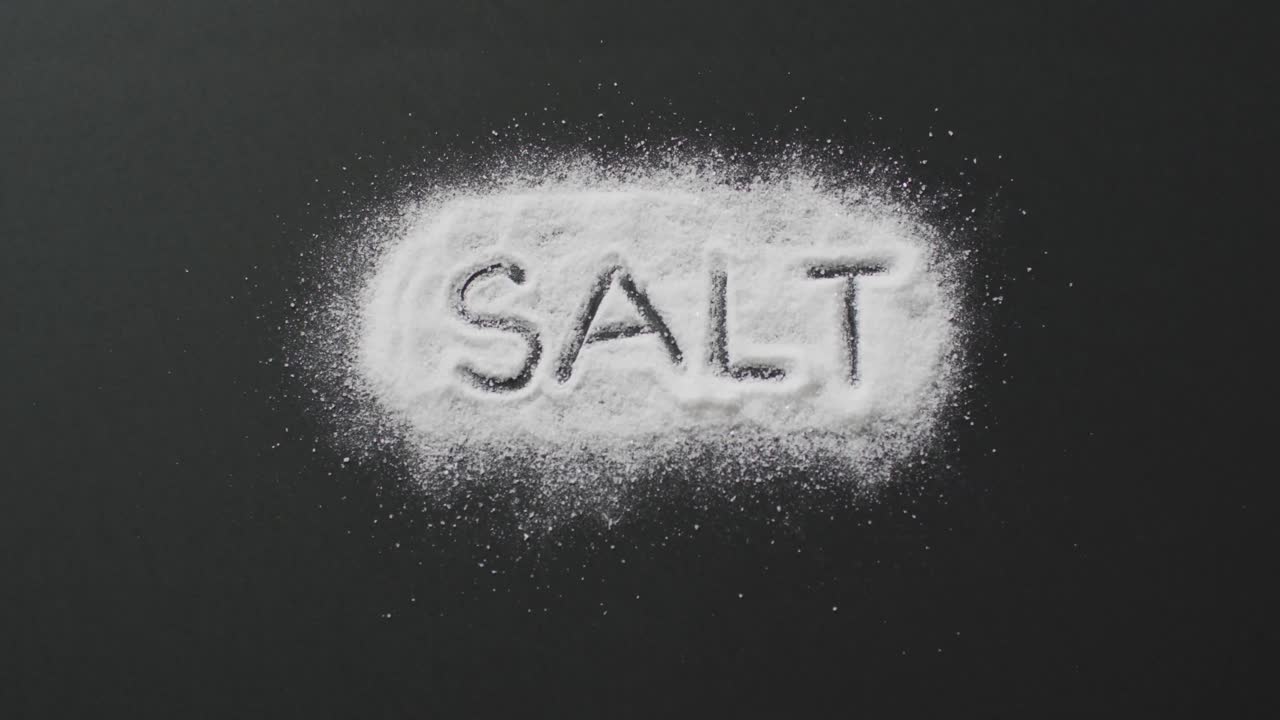 Animation of salt text written in salt on black background