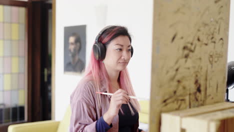 Vibing-to-music-headphones-while-canvas-painting-Korean