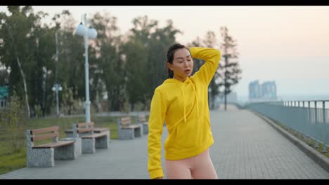 woman resting after a run in the park