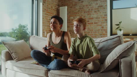 mother and son playing video games together