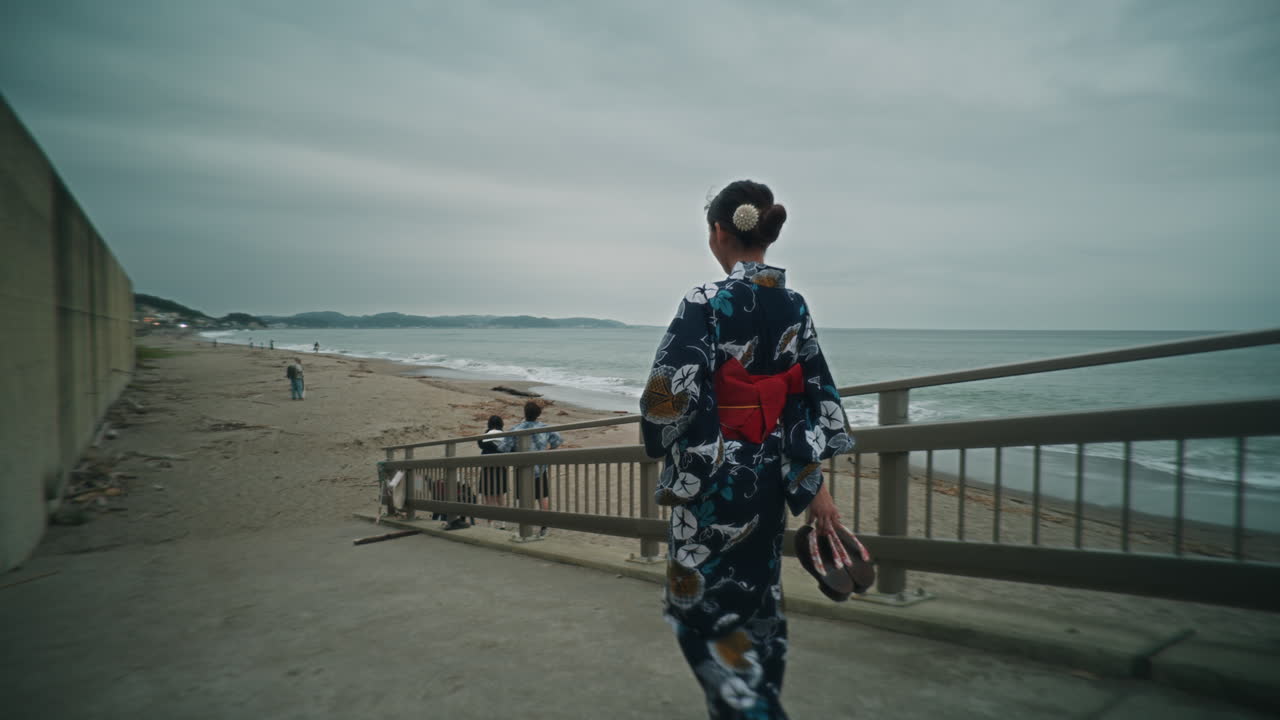 Woman in Kimono on Beach