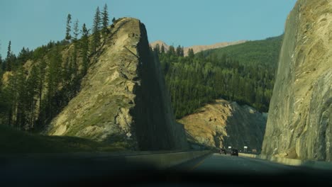 Free-way-through-the-mountain-ranges-of-the-Rocky-Mountains-in-Alberta,-Canada