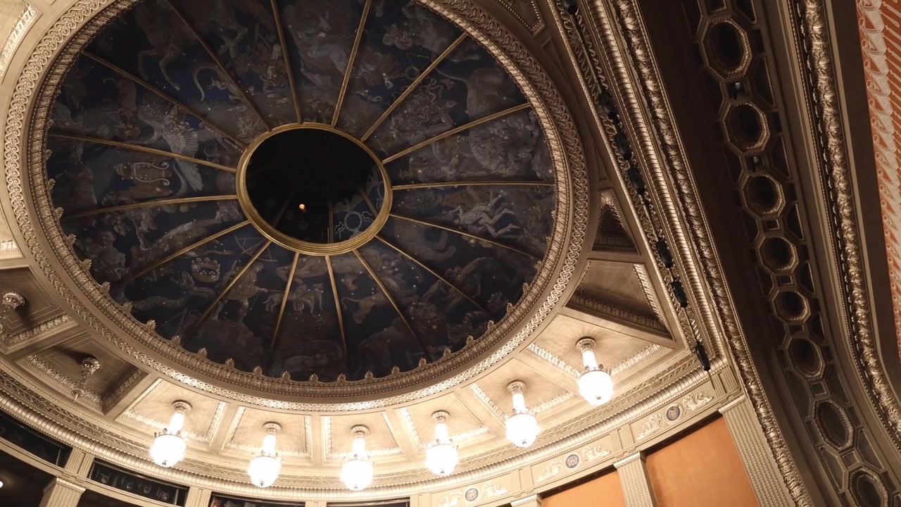 Stuttgart Opera House. Ornate ceiling and chandelier details inside a richly decorated historic interior.