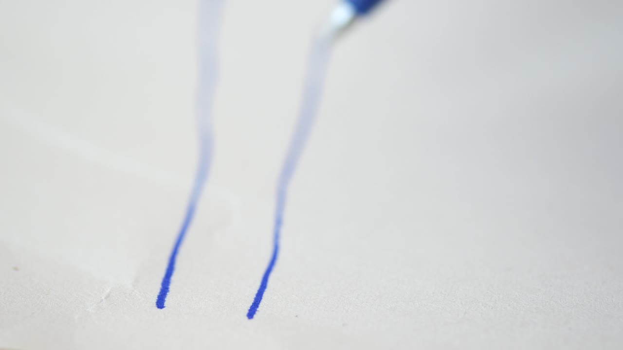 Blue Pen Writing on Paper