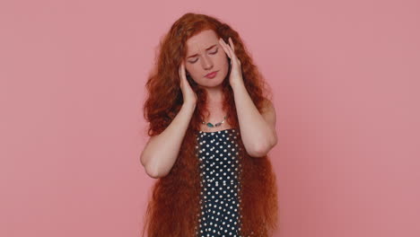 ginger girl rubbing temples to cure headache problem, suffering from tension and migaine stress pain