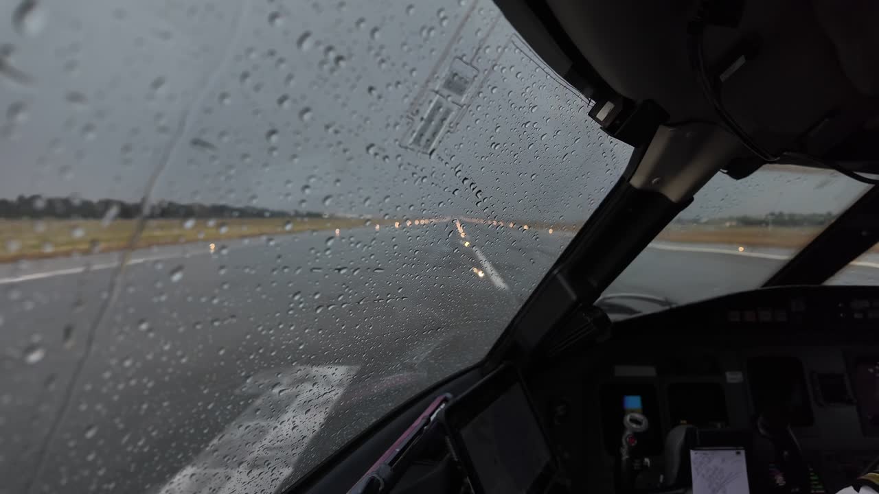 an immersive cockpit view in a real time take-off, initial run, as seen by the pilot through the left windshield.