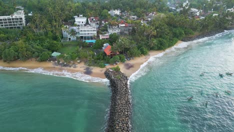 aerial shot of turtle bay beach resort at sunrise in mirissa, sri lanka