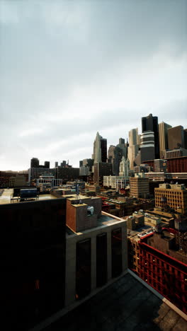 a panoramic view of a city skyline with tall buildings and cloudy sky