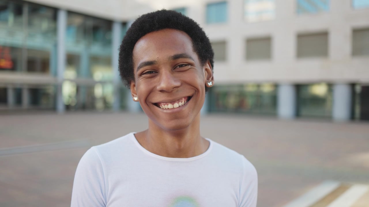Happy Young Black Man Smiling and Laughing Outdoors