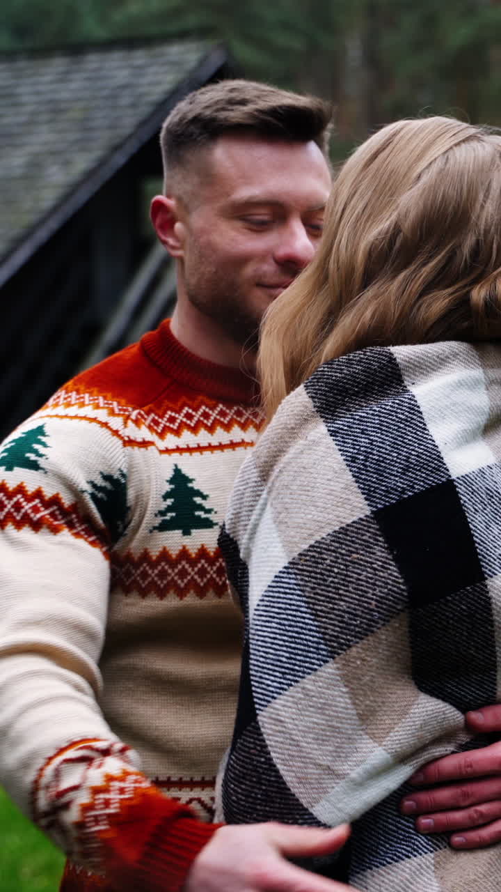 Young couple in love. Romantic couple standing close to each other in warm autumn day. Happy man and beautiful woman having time together outdoors. Vertical video