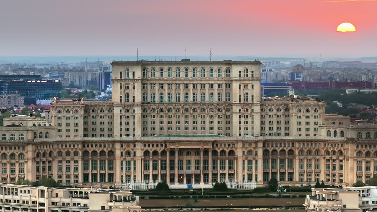 Aerial drone view of the Palace of Parliament in Bucharest, Romania at sunset