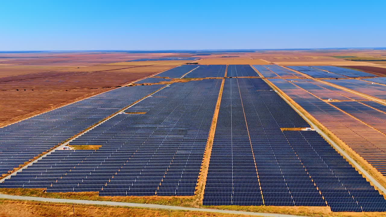 Enormous bare fields with photovoltaic cells. Solar panels accumulate sun energy