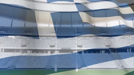 flag blowing in front of a stadium