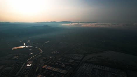 Morning-mist-and-sunrise-above-Koper,-Capodistria-in-Slovenia,-Aerial-view