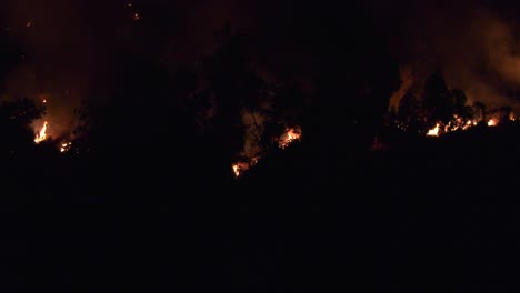 Flames-consume-large-hillside-at-night