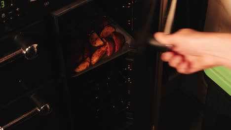 spicy paprika raw potato wedges put in oven by chef to cook