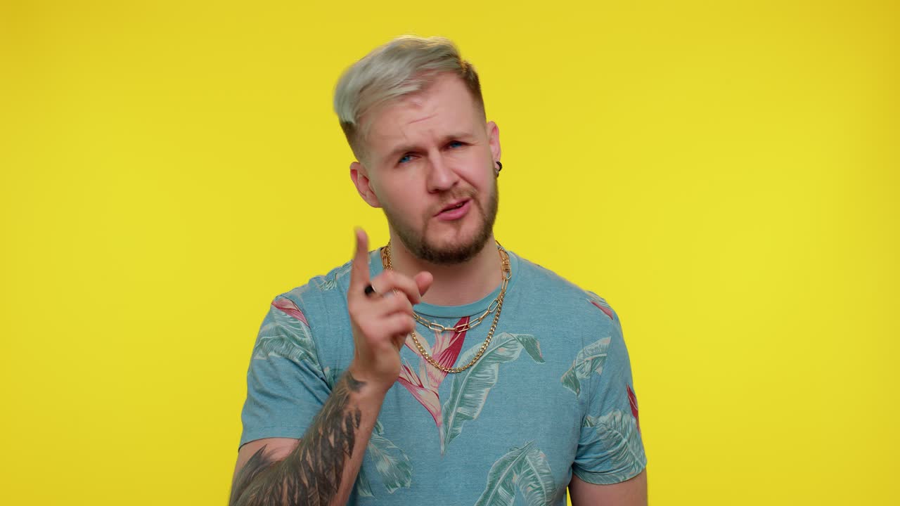 Man shakes finger and saying no, be careful, scolding, giving advice to avoid danger mistake