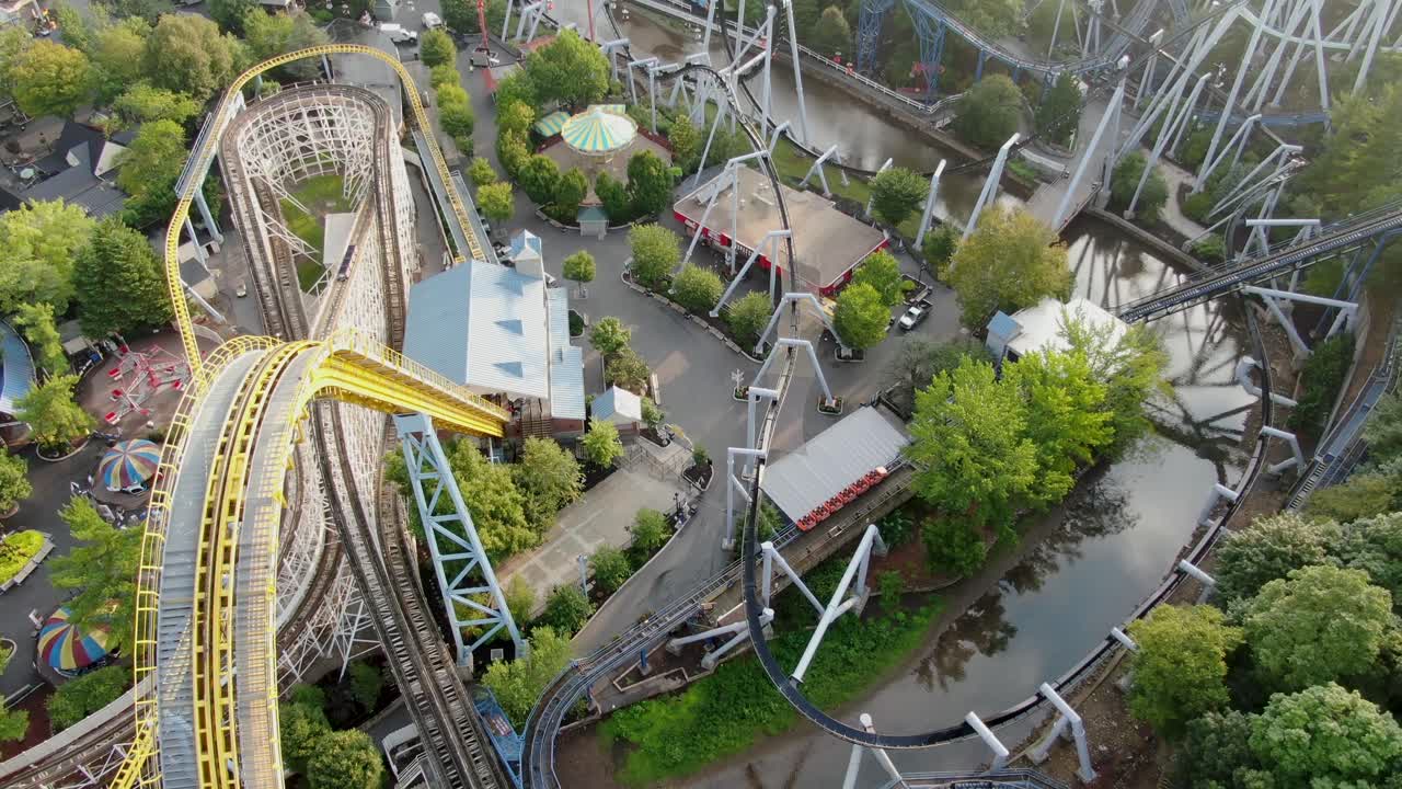 Dramatic roller coasters and amusement Park rides in Pennsylvania, USA, aerial drone view