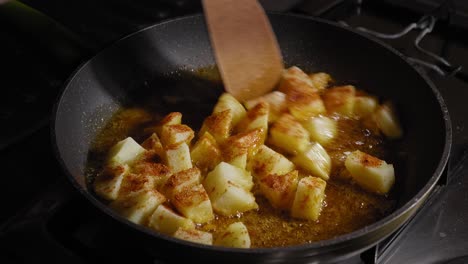 delicious hot fried potatoes are cooked in a frying pan