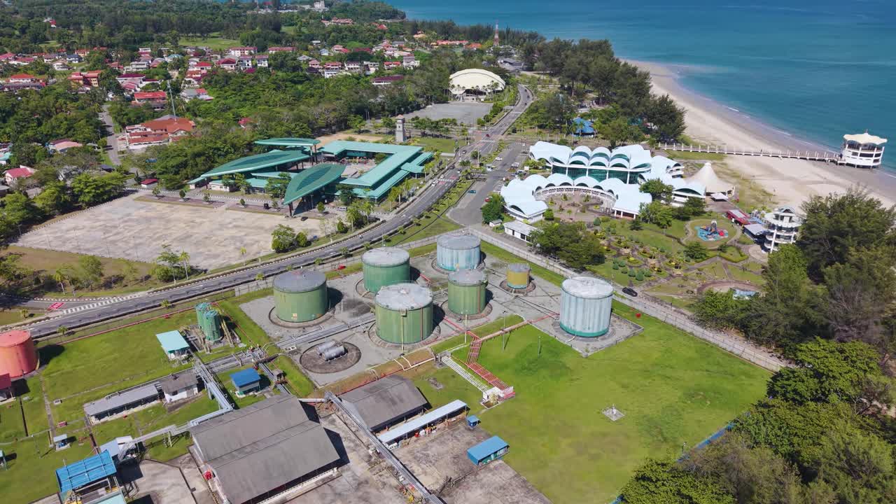 Aerial view of the Labuan water treatment facility in Malaysia, featuring storage reservoirs and coastal surroundings, symbolizing sustainable infrastructure and clean water management