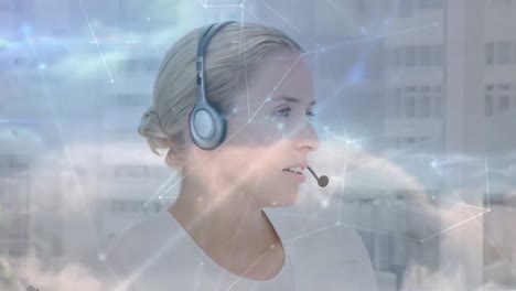 Animation-of-networks-of-connections-over-businesswoman-using-phone-headsets