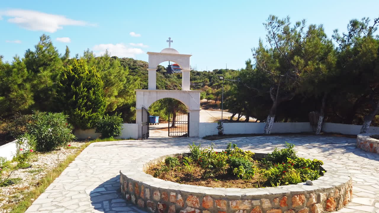 Entry in the inner court of a church in Greece. A lot of greenery