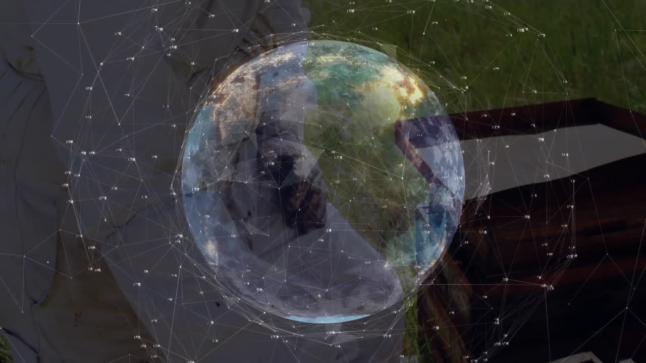 Man holding floating holographic Earth globe, illustrating technology network lines and data points