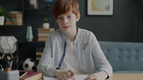 boy doing homework at home