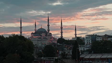 iconic blue mosque with vivid clouds at sunset in background, istanbul, turkey