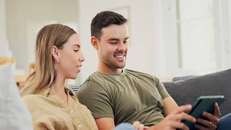 Tablet,-couple-and-relax-on-sofa-in-home-living