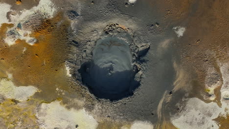 bubbling mud pot in a geothermal area, directly above view