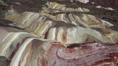 surreal colours on cerro de los 7 colores mountain in argentina aerial