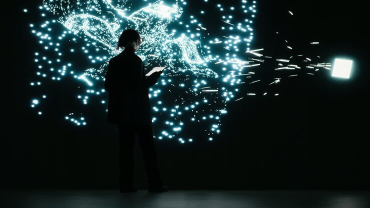 Silhouette of Person Interacting with Digital Particle Display