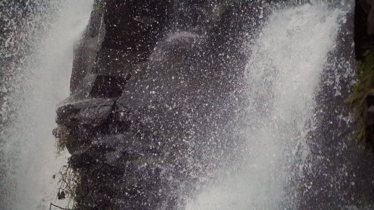Powerful Waterfall Splashing on Rocks
