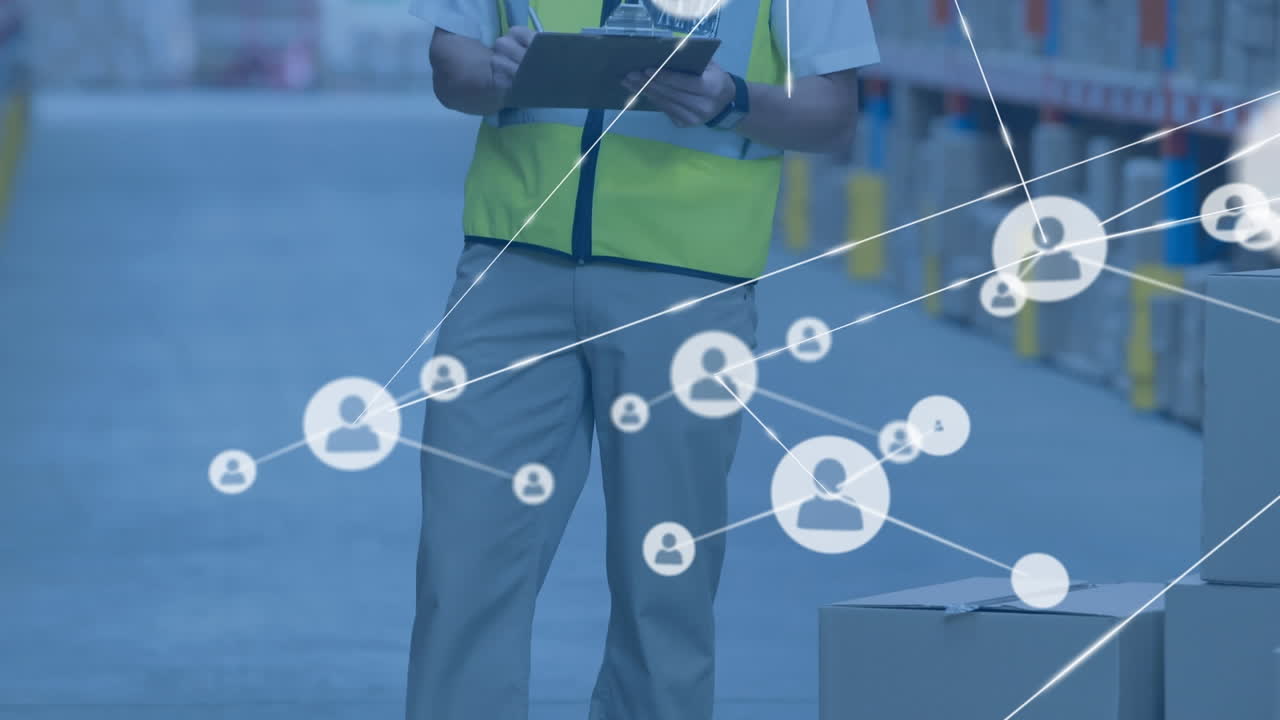 Animation of network of connections with icons over man writing on clipboard in warehouse