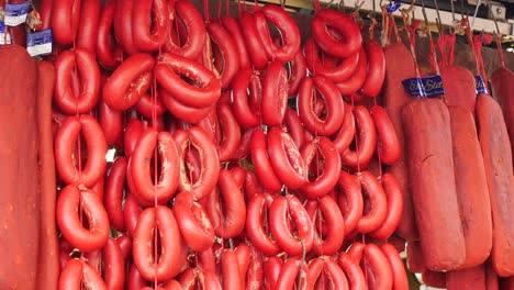 turkish red sausages hanging in a market