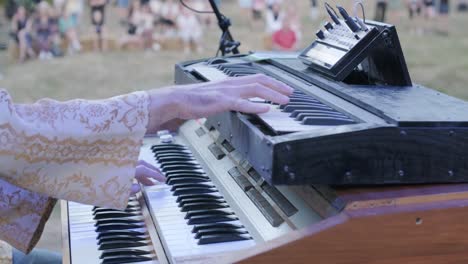 the musician plays on the vintage big piano keyboard. many keys and buttons on a big old piano.