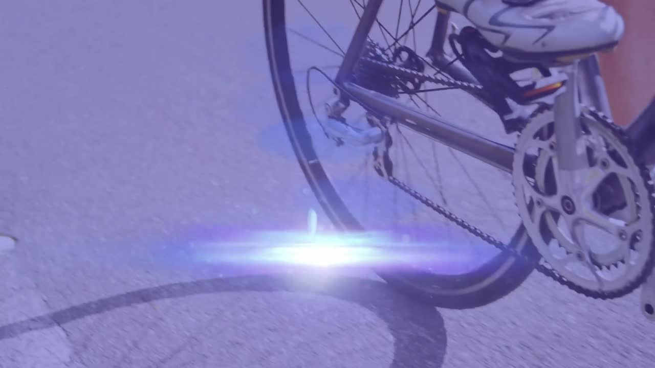 animación de puntos de luz sobre una mujer caucásica en bicicleta