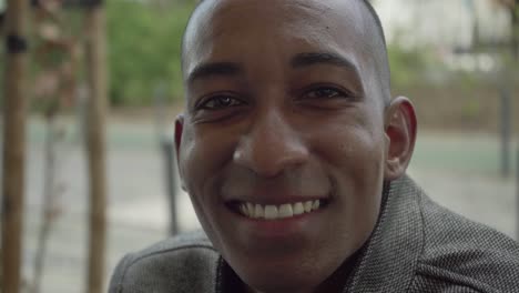 happy young man smiling at camera