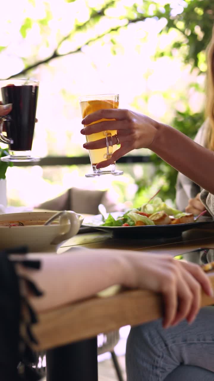 Friends toasting drinks at a restaurant