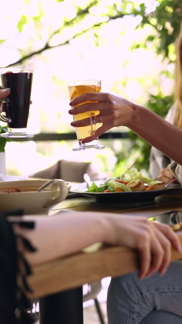 Friends toasting drinks at a restaurant